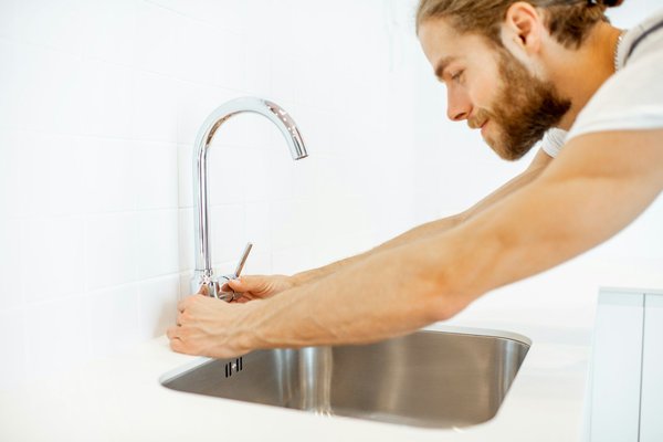 What specific type of kitchen faucet is best for a diet-focused kitchen to improve hygiene and water efficiency?